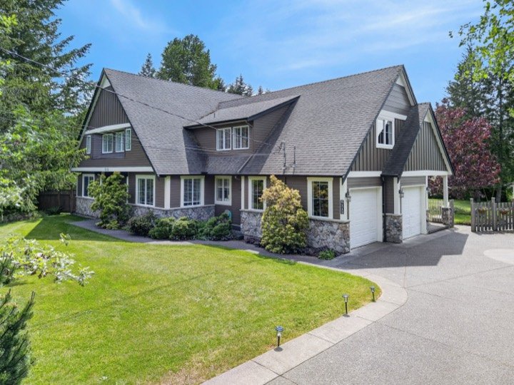Aerial view of a two-storey home with a triple garage