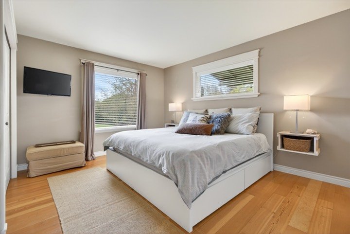 Primary bedroom with hardwood floors