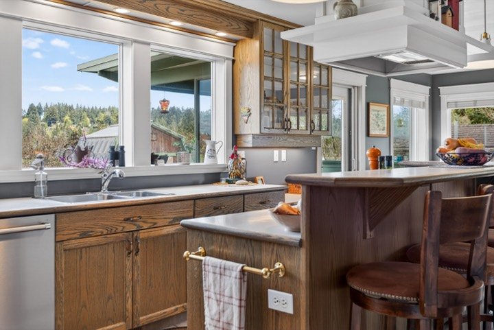 Farmhouse-style kitchen with wood cabinets and a view over the sink
