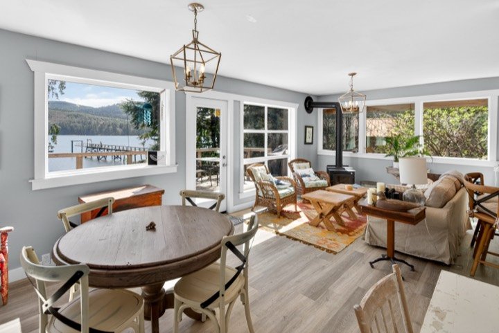 Lakeside cottage living and dining area with a water view