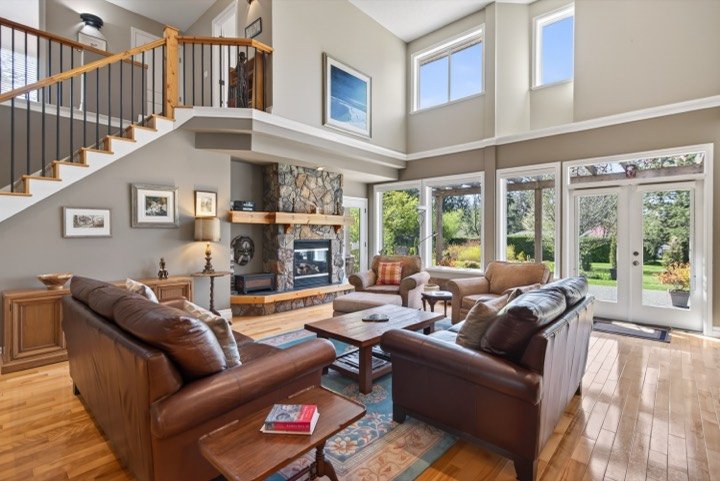 Two-storey great room with a stone fireplace