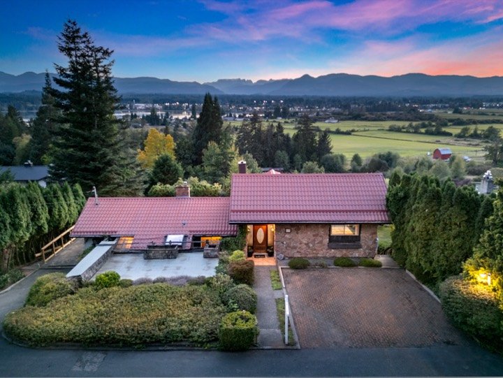 Twilight aerial of a home overlooking the valley