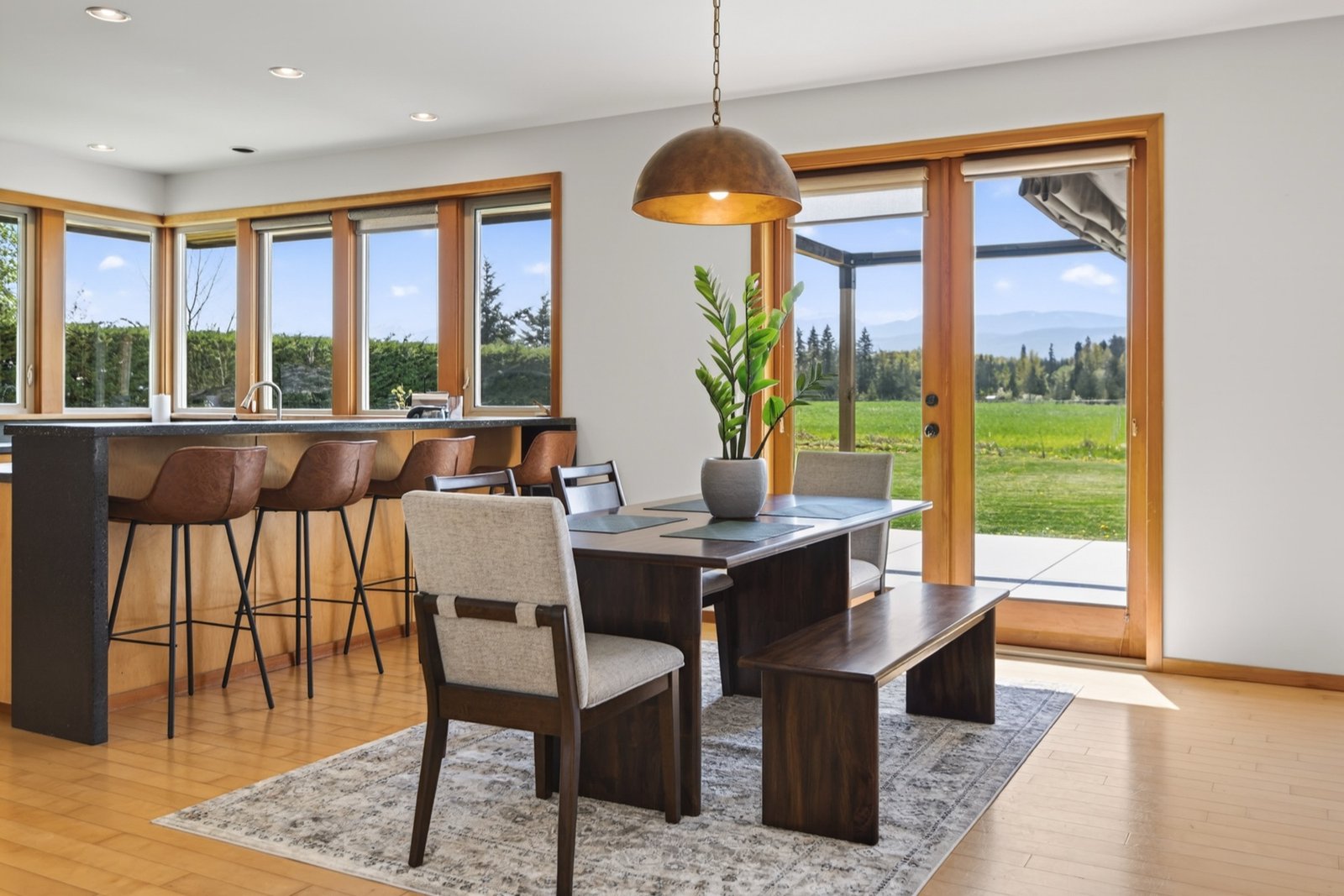 Dining area with mountain views through French doors