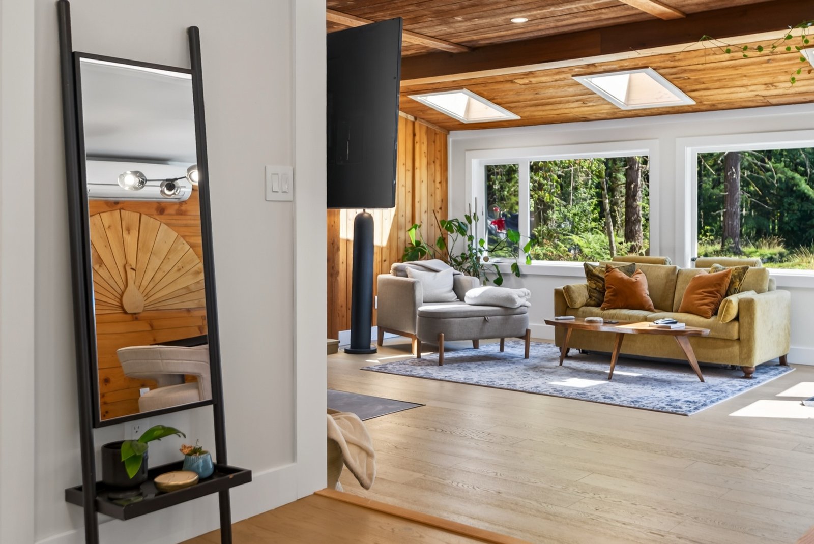 Living room with skylights and a wood-plank ceiling
